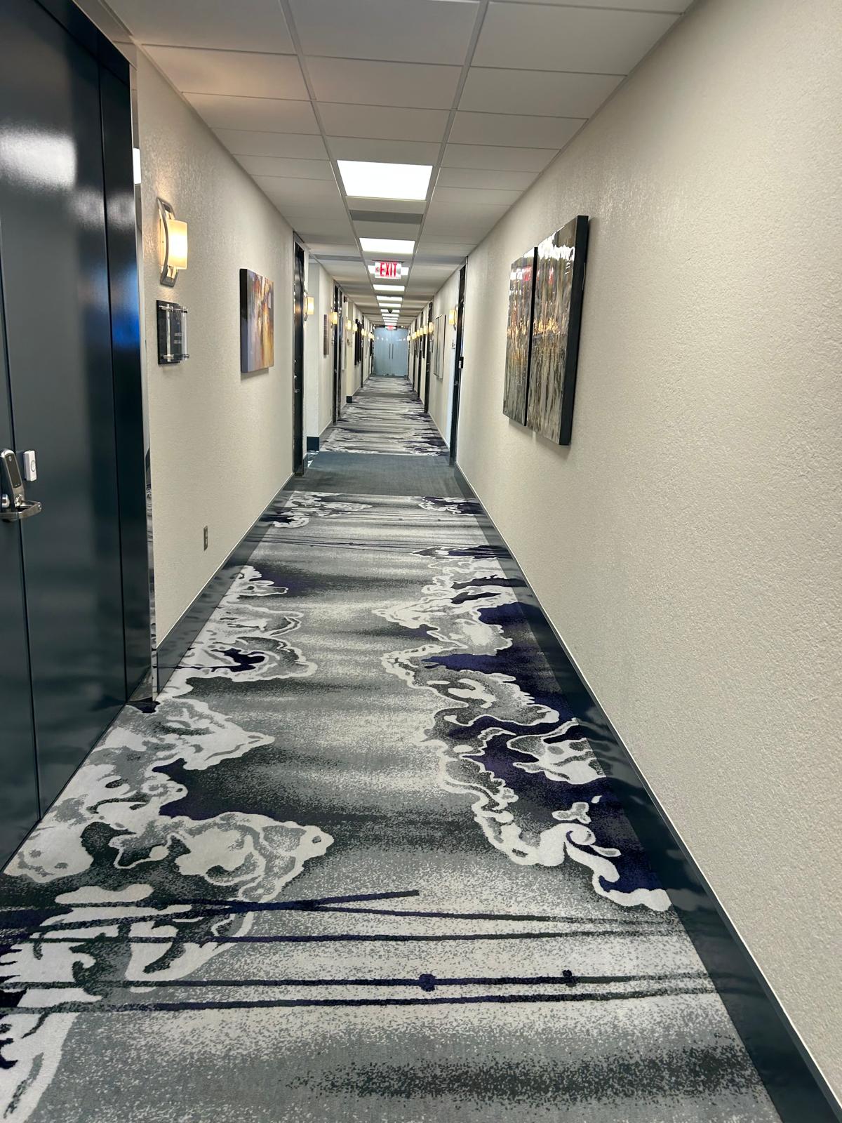 Patterned carpet in commercial hallway