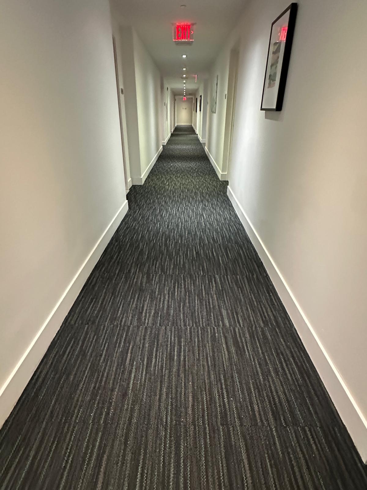Hallway carpet installation by Imperio Flooring INC.